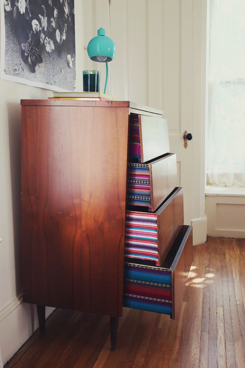 Try this: Fabric lined dresser drawers