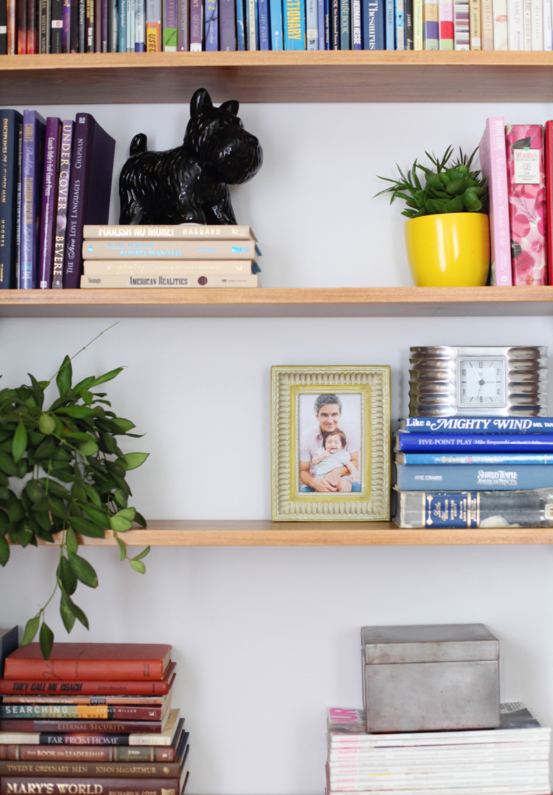 It's pretty simple to build your own shelving system. Click through for instructions and styling tips!