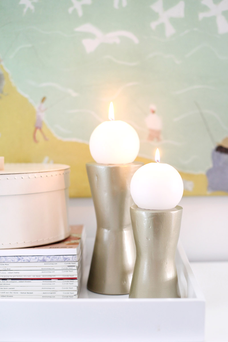 Make your own modern metalic candle stands with disposable cups! Click through for simple instructions + photos.
