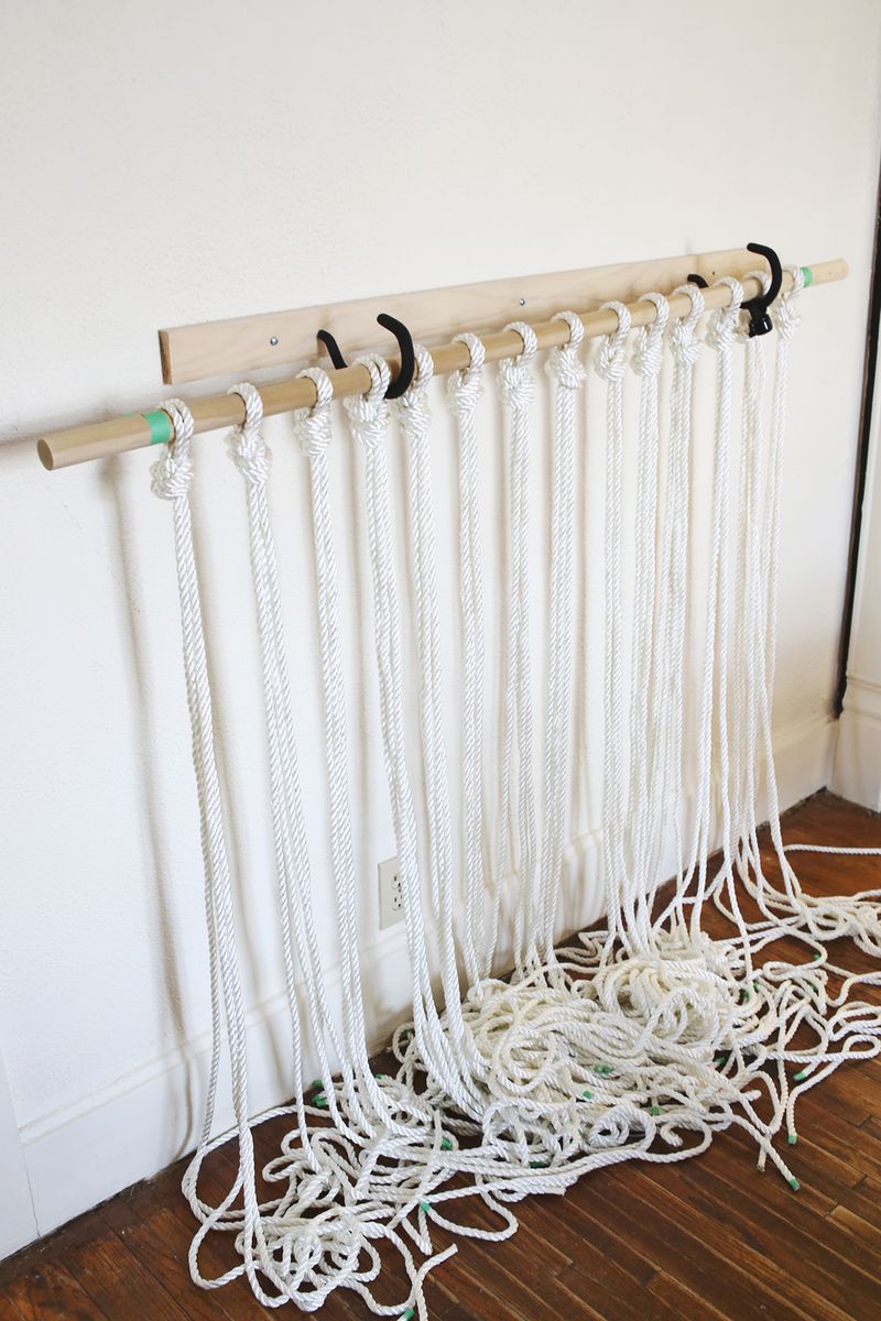 white rope hung from a wooden rod