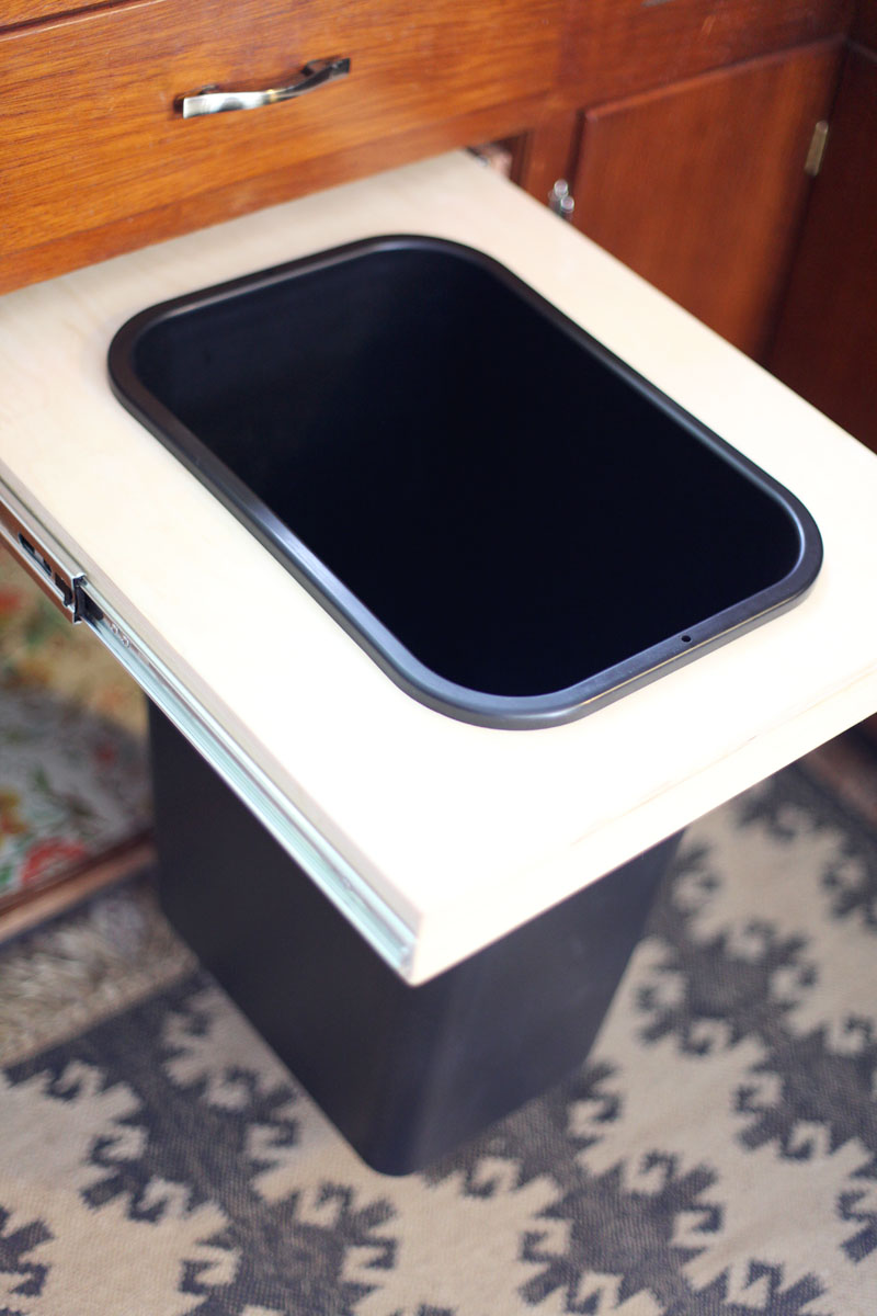 How to convert a cabinet into a pull-out trash bin- get that trash can out of sight!