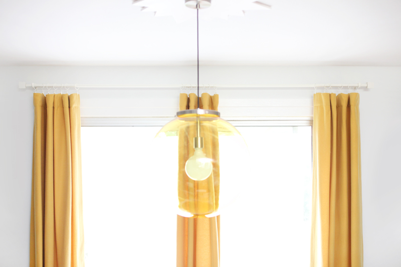 Save your dollars for drapes with this budget curtain rod and finial DIY!
