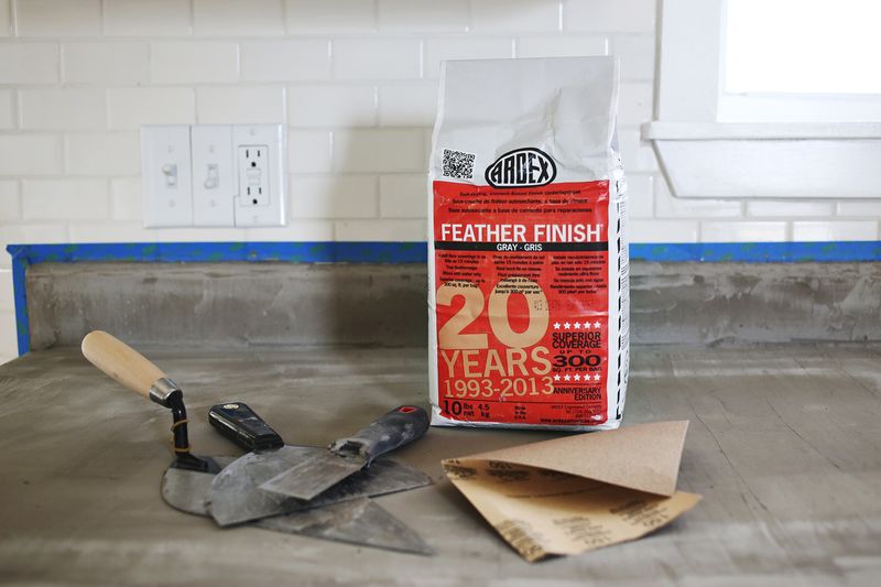 bag of feather finish on countertops with mudding tools