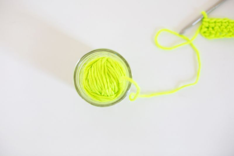 Use a jar to keep ball of yarn in place while crocheting!