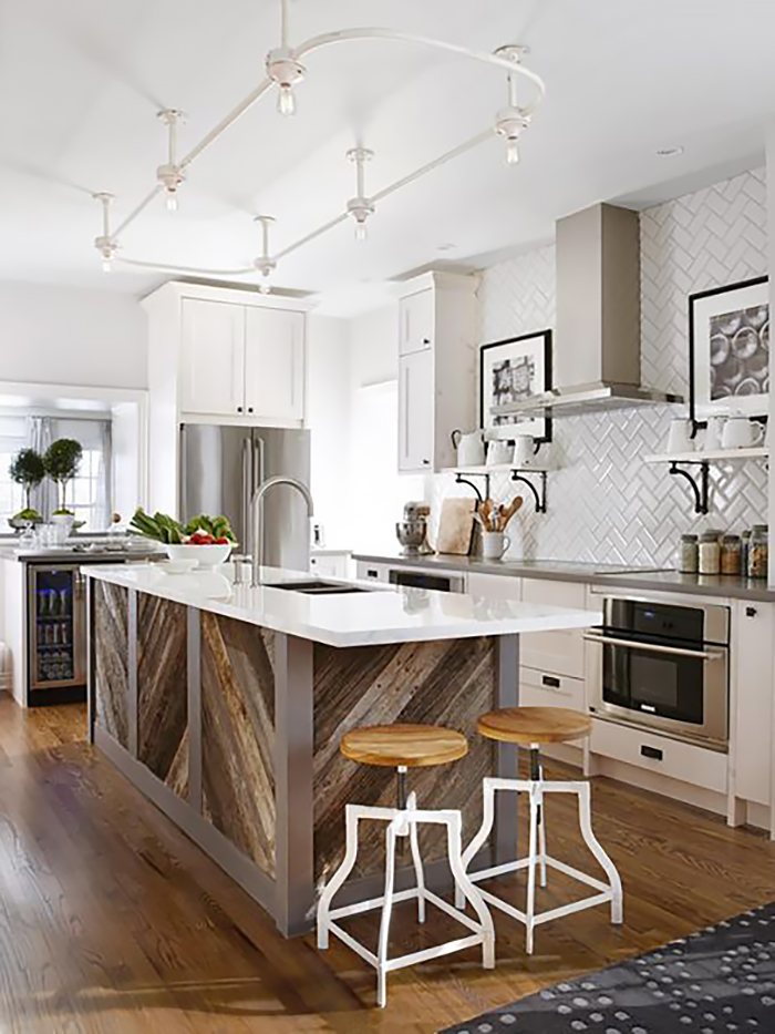 White Traditional Herringbone subway tile in a kitchen with white cabinets and a big island