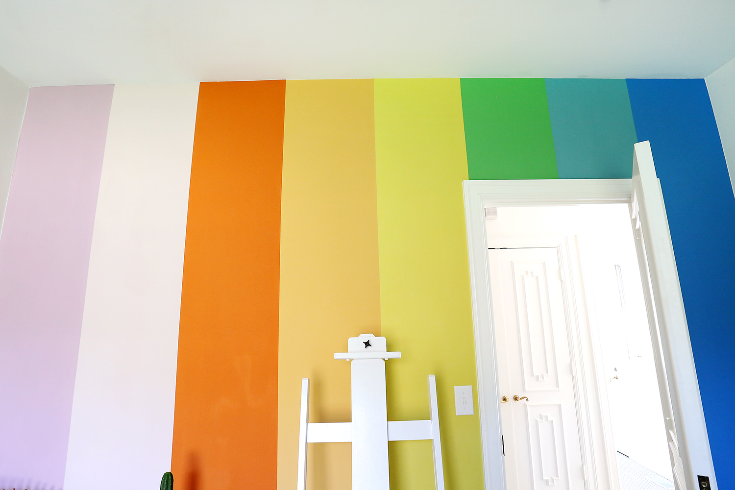 DIY rainbow wall with chalk paint! See more on ABeautifulMess.com 