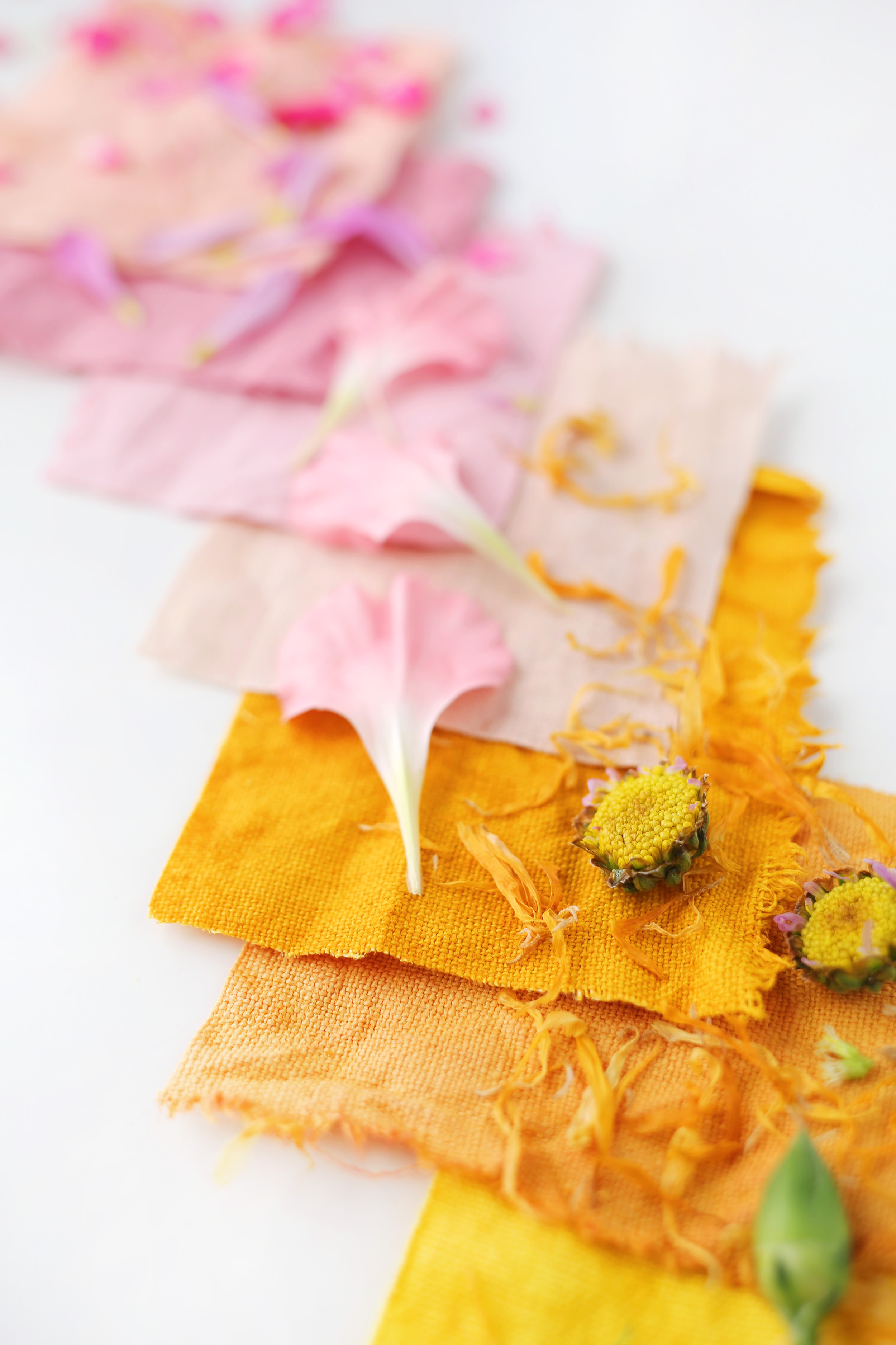 6 colorful natural dyed square pieces of canvas bags with flower petals on them