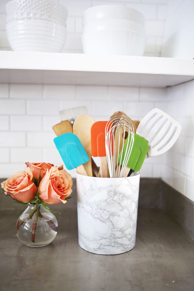 Try this! Recover your utensil holder with marble contact paper for a inexpensive marble look 