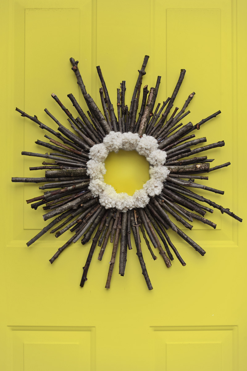 Make a twig and pom pom starburst wreath— It's practically free!