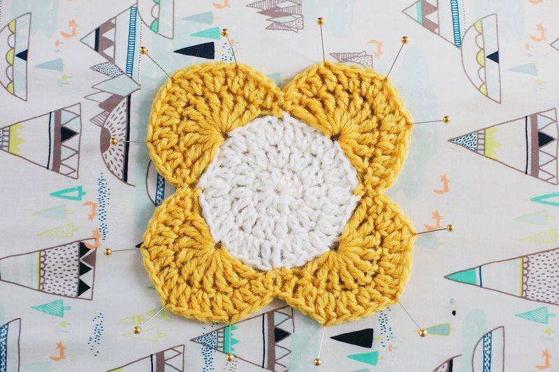 Use pins and an ironing board to block small crochet projects!