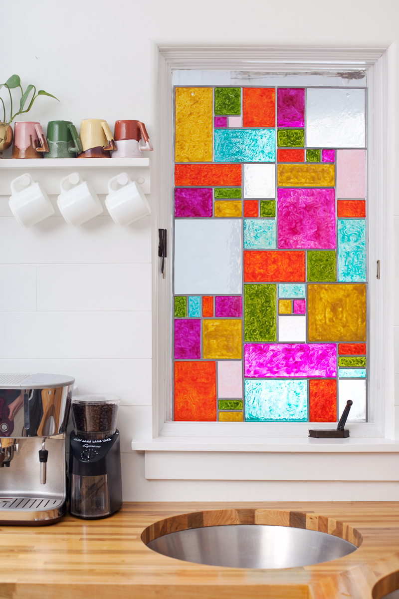 faux stained glass window in a kitchen with butcher block countertops