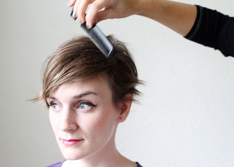 Comb hair over to create a deep part