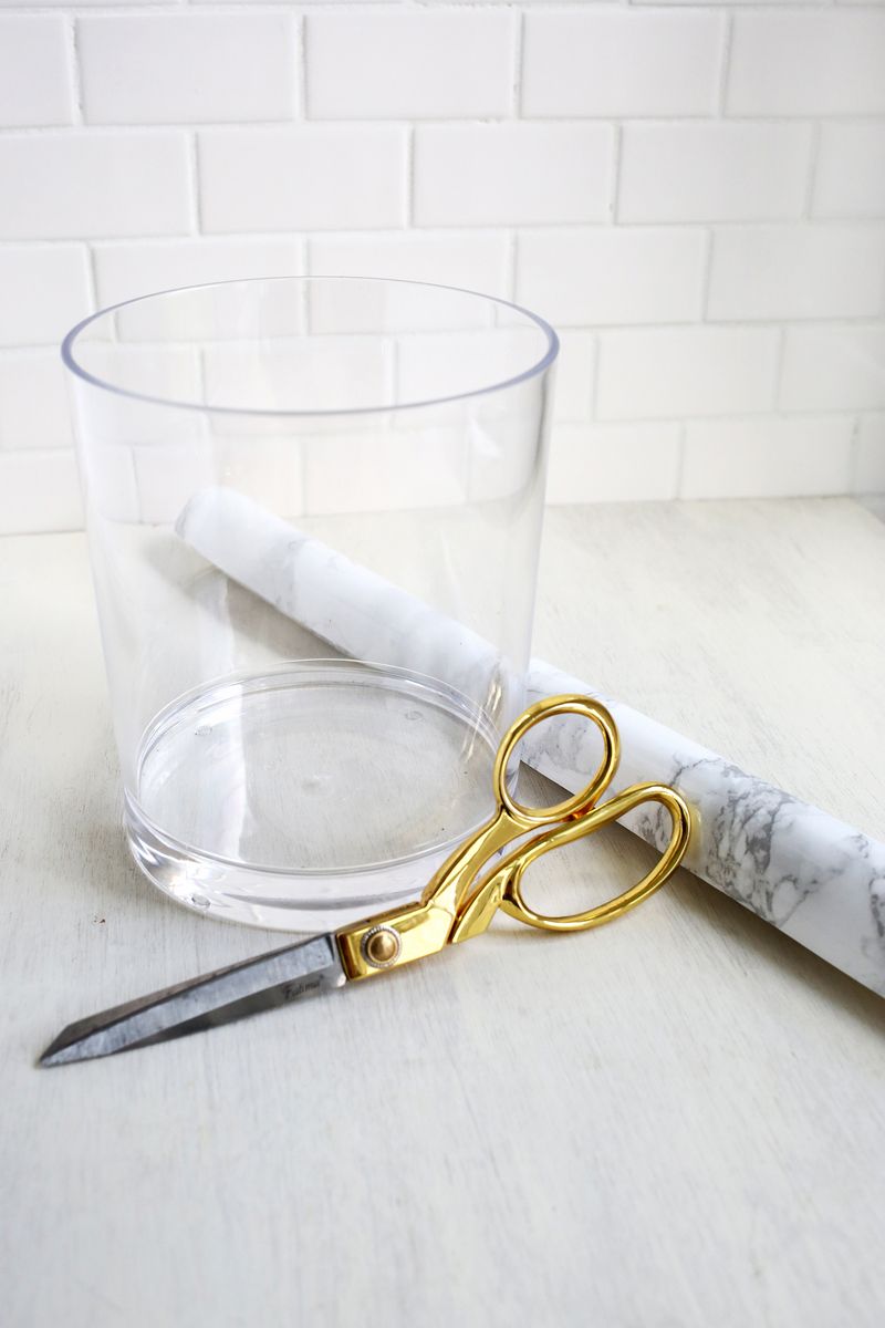 Try this! Recover your utensil holder with marble contact paper for a inexpensive marble look 