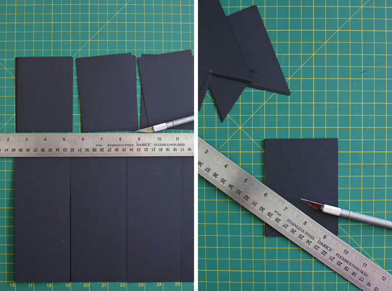 pieces of black construction paper with a ruler and craft blade on top