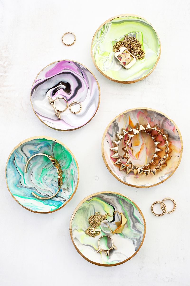 4 marbled clay ring dishes with jewelry in them