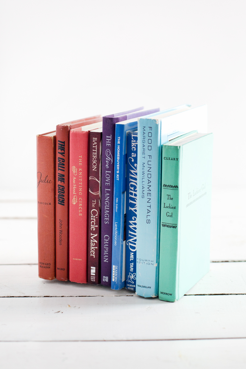 Turn discarded books into invisible bookends for a streamlined bookshelf display.