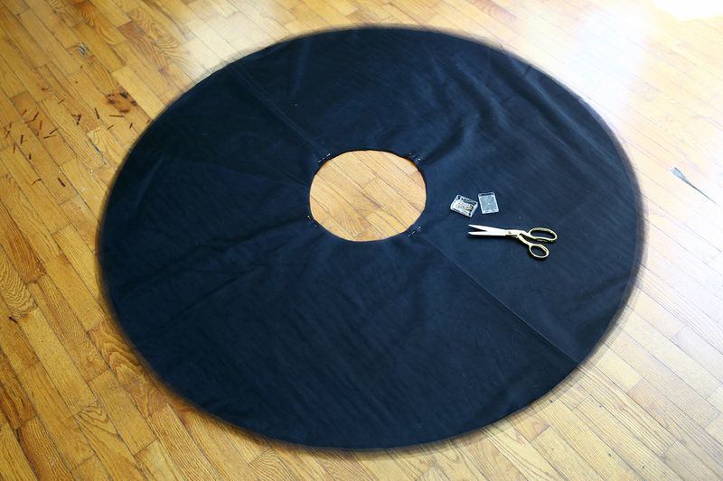 black tulle in a circle shape with gold scissors