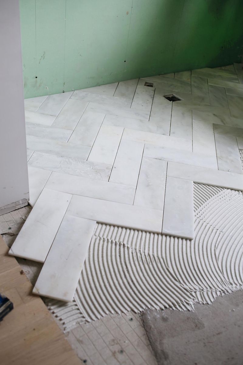 Cut 12x12 marble into 4x12 strips for herringbone pattern
