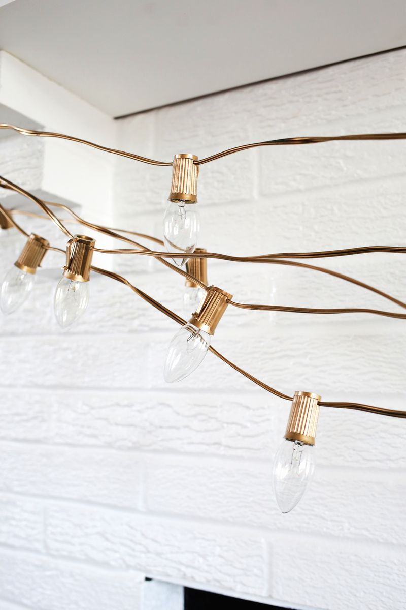 Spray paint light cords gold for a festive look! (click through for more) 